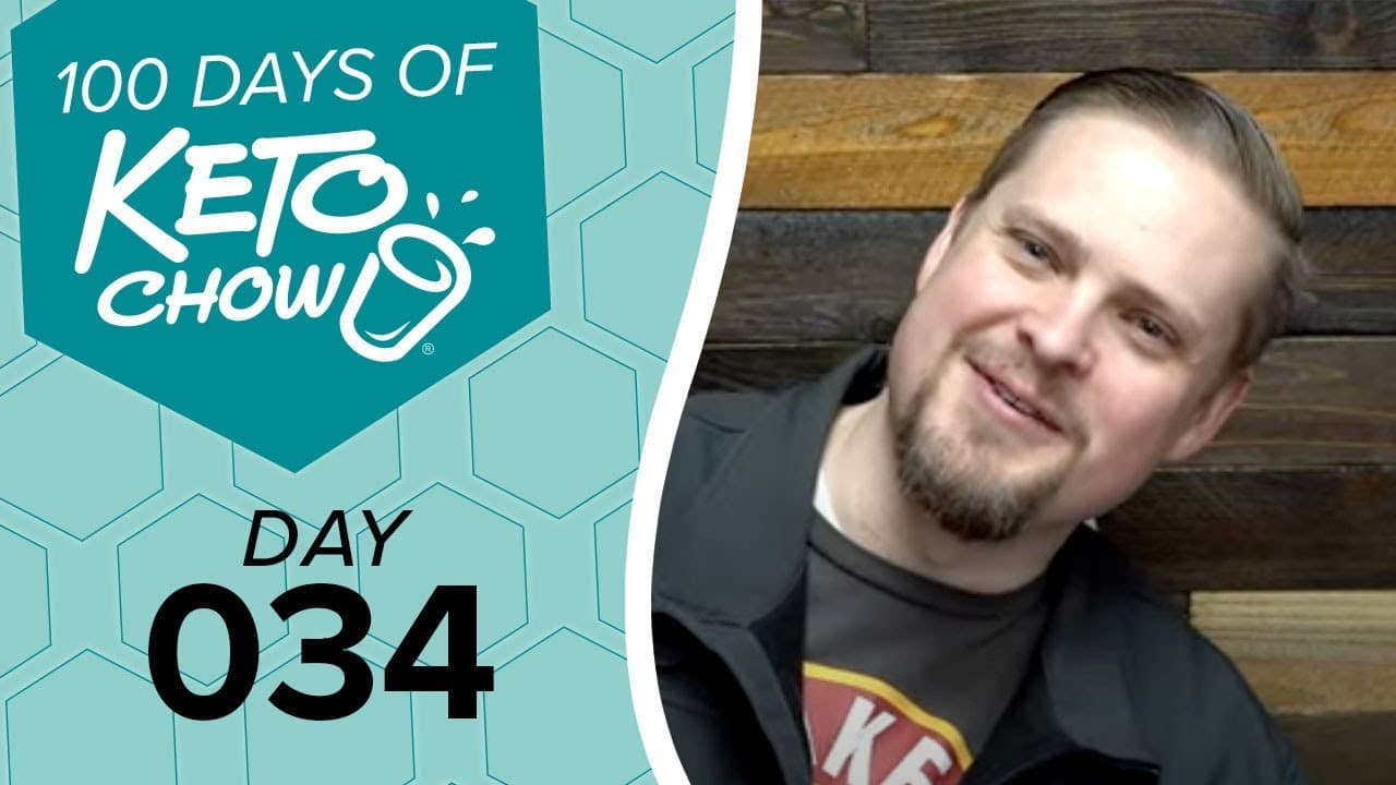 Teal digital graphic shows 100 DAYS OF KETO CHOW logo with a cup icon, and DAY 034 text. A man with a beard smiles beside it.