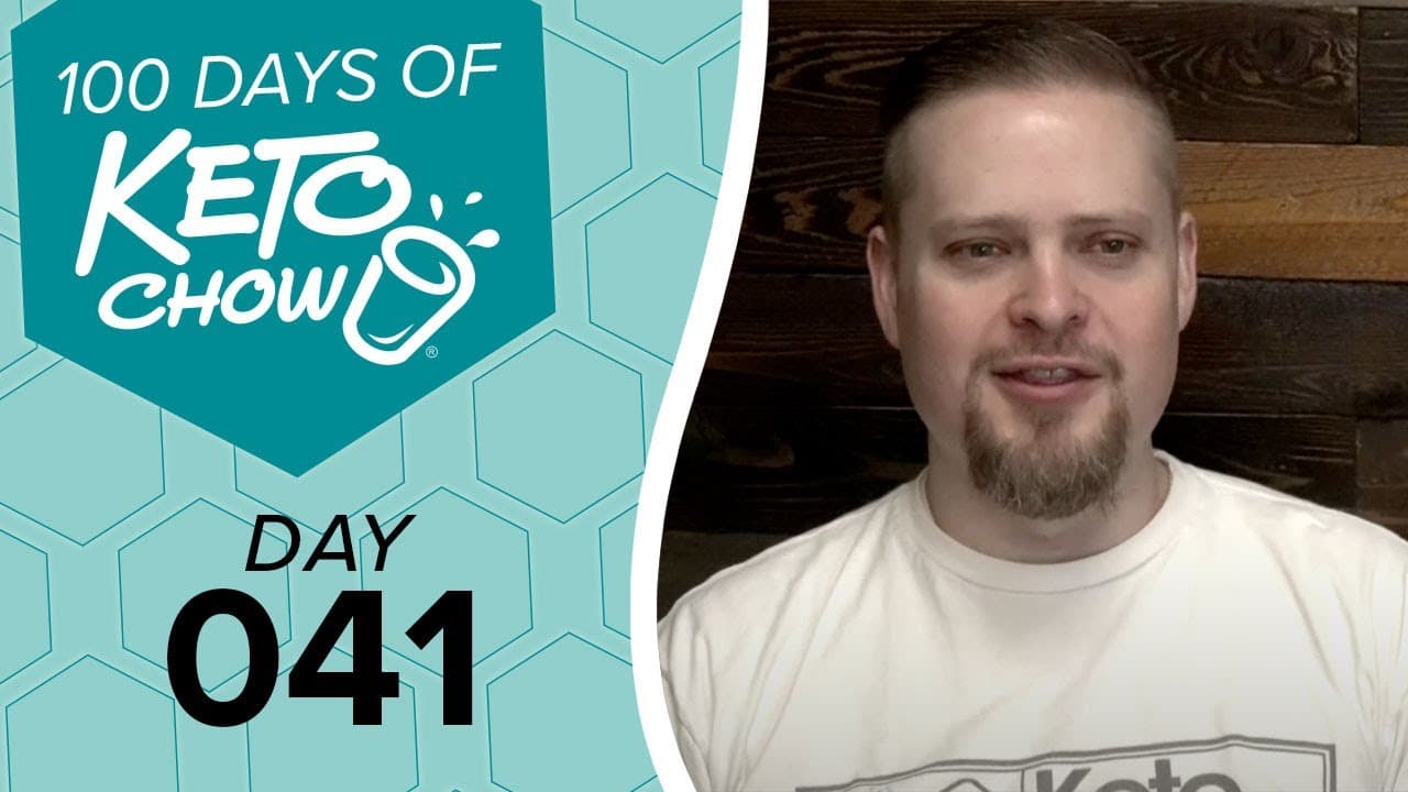 Promotional graphic with 100 DAYS OF KETO CHOW logo in white on teal, text DAY 041, and a smiling man with a beard.