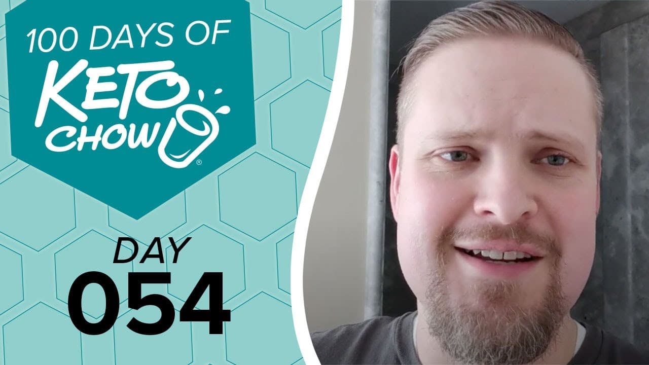 Teal graphic features KETO CHOW logo, 100 DAYS OF KETO CHOW in white, and DAY 054 in black. A man with a beard smiles on the right.