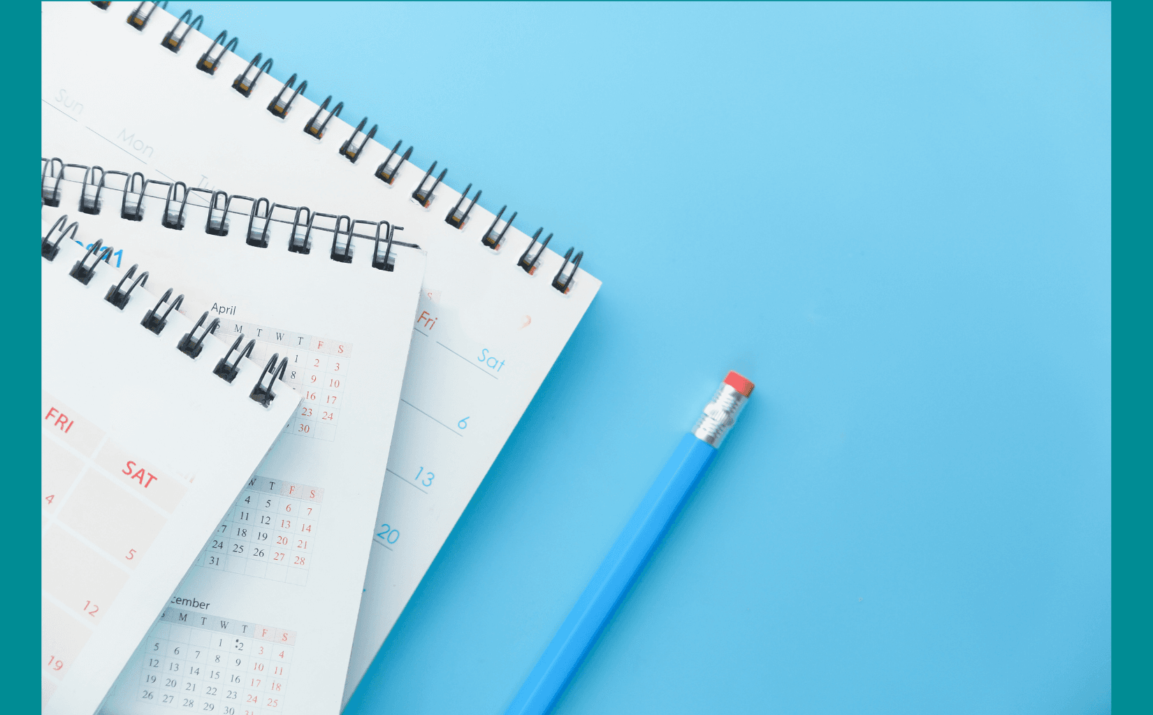 Three desk calendars with black spiral binding and white pages, displaying April and December dates, lie on a light blue background next to a blue pencil with a red eraser.