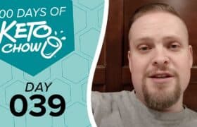Graphic with 100 DAYS OF KETO CHOW and DAY 039 text on a teal and light blue hexagonal background, beside a man in a grey shirt.