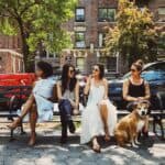 women sitting on bench