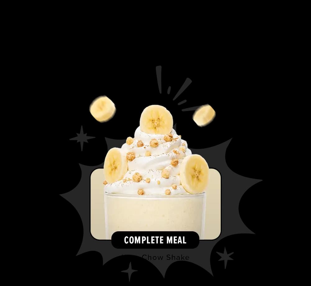 A shake topped with whipped cream and bananas.