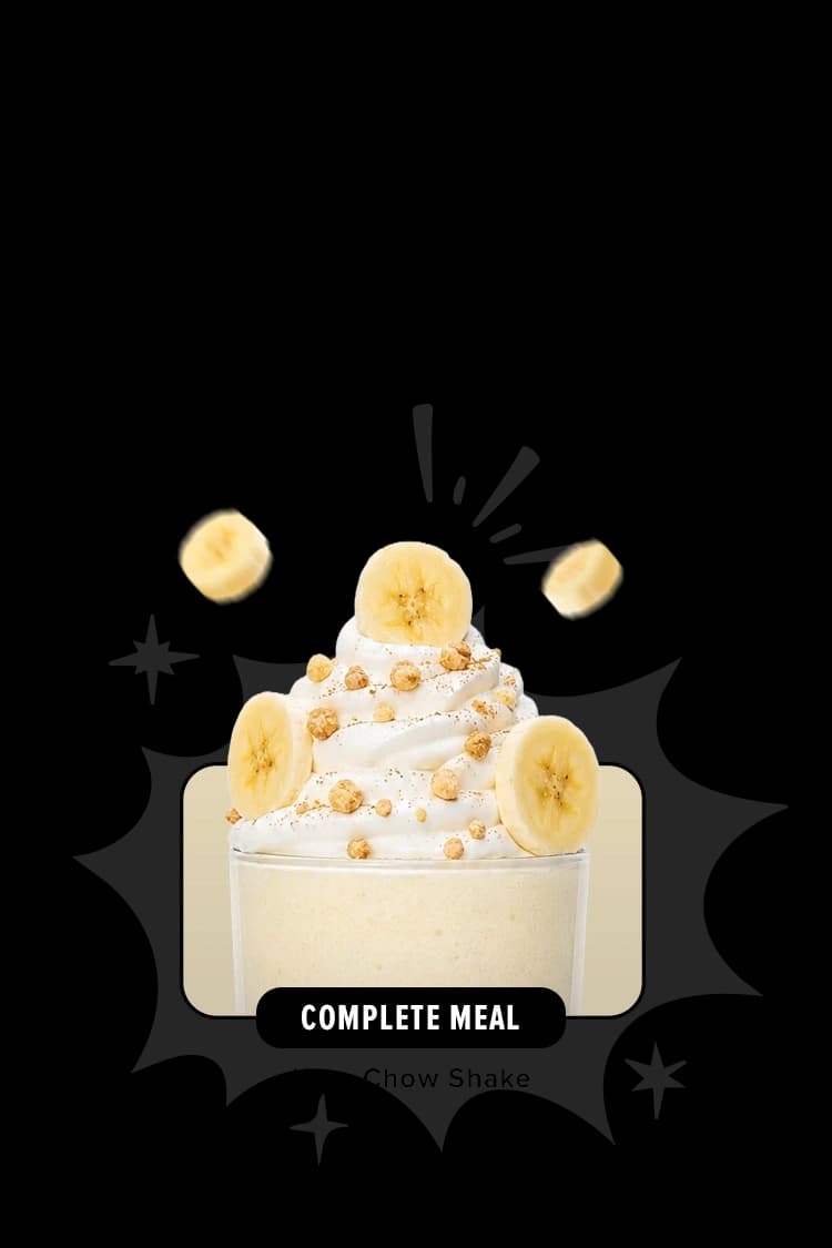 A shake topped with whipped cream and bananas.