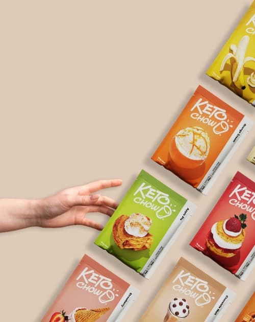 A hand reaching for packets of Keto Chow
