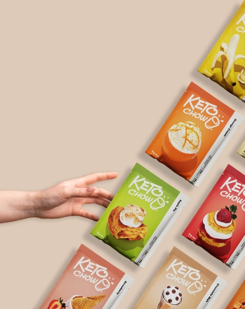 A hand reaching for packets of Keto Chow