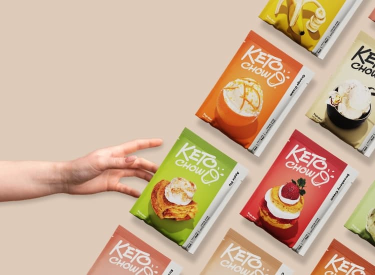 A hand reaching for packets of Keto Chow
