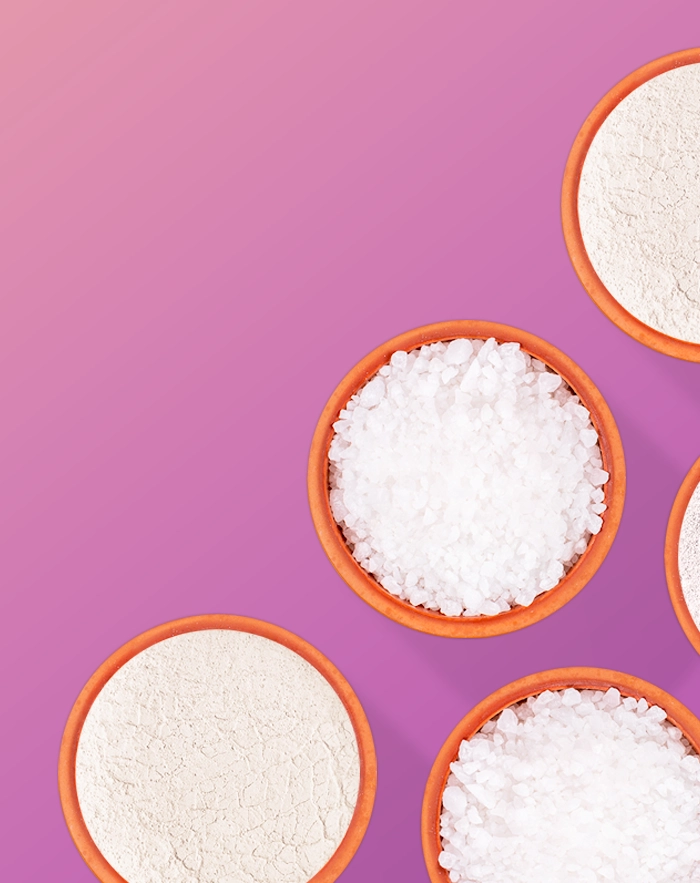 Overhead view of bowls of white granular material