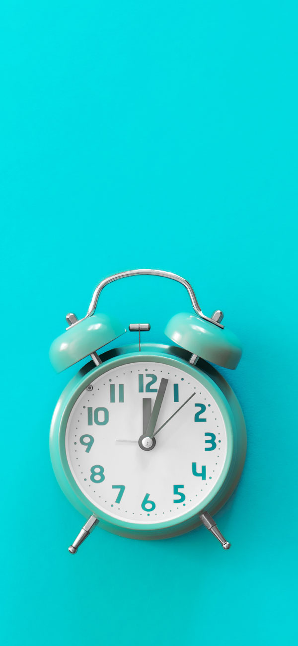 A blue alarm clock on a blue background