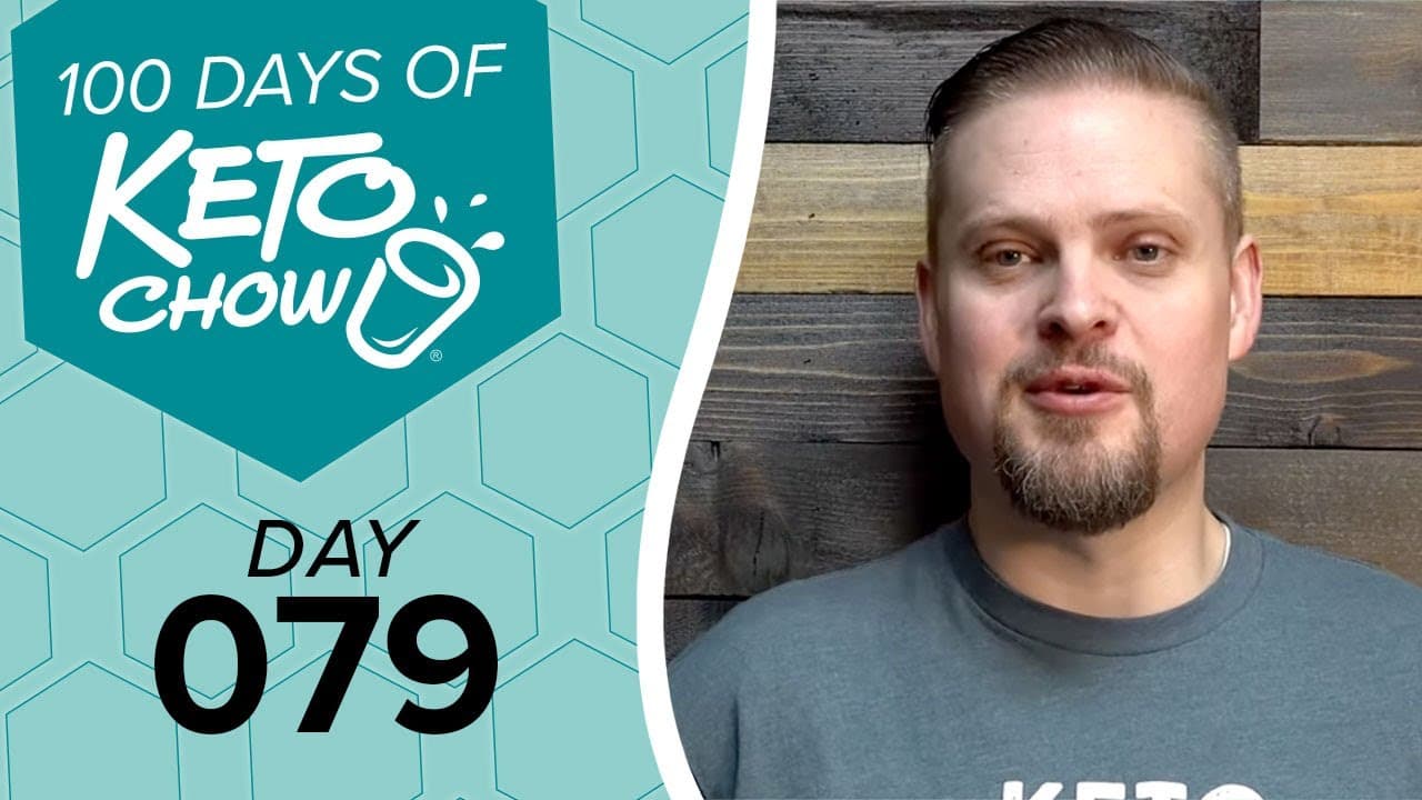 Graphic title 100 DAYS OF KETO CHOW with shaker icon on teal background, showing Day 079. Right side features a man in a grey t-shirt with a KETO logo, against a wooden wall.
