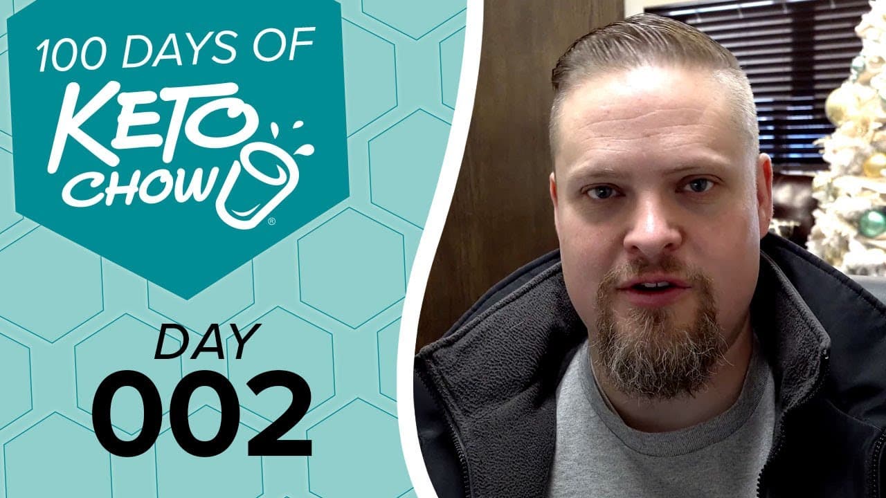 KETO CHOW graphic: 100 DAYS OF KETO CHOW, DAY 002. Teal background with hexagonal pattern and KETO CHOW logo. Man on right.