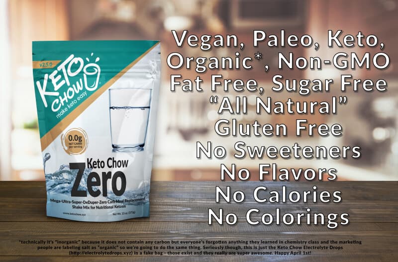 White and teal Keto Chow Zero stand-up pouch for Mega-Ultra-Super-DeDuper-Zero Carb Meal Replacement Shake Mix, displaying 0.0g Net Carbs, a glass of water, and a blue water splash graphic. The pouch features the KETO CHOW logo with make keto easy and v2.5.0. Net Wt. 13 oz (372g) and www.ketochow.xyz are visible. Overlaying the background are white text claims: Vegan, Paleo, Keto, Organic, Non-GMO, Fat Free, Sugar Free, All Natural, Gluten Free, No Sweeteners, No Flavors, No Calories, No Colorings. Smaller text at the bottom indicates it is Keto Chow Electrolyte Drops in a fake bag and mentions Happy April 1st.